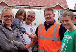 Elle, 5, shakes hands with Council Worker Richard Greensmith safe in the arms of dad, Paul and alongside brothers Christopher, 14, (left) and Jonathan, 12 (right). Elle, 5, shakes hands with Council Worker Richard Greensmith safe in the arms of dad, Paul and alongside brothers Christopher, 14, (left) and Jonathan, 12 (right).