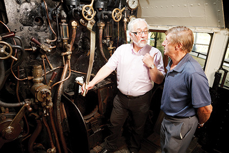A volunteer shows a museum visitor the ropes. Gala