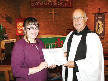The Archdeacon of Durham, the Venerable Ian Jagger, presents Eileen Bowman with her certificate in Living Theology.