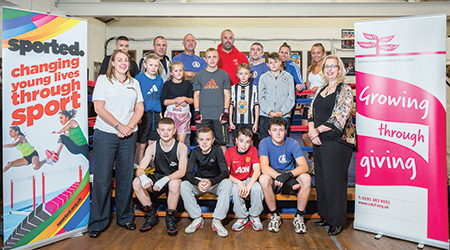 Sandra Hillyard, Sported Regional Manager for the North East (left) and Jane Robson, Development Manager for County Durham Community Foundation (right) with members of Bishop Auckland Boxing Club. boxing