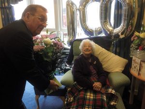 cllr-brian-turner-presenting-elizabeth-atkinson-flowers-for-100th-birthday