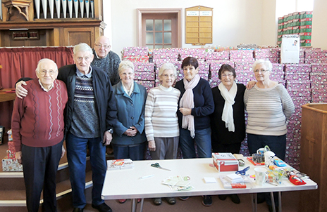 A small part of the large team of helpers with some of the 1,028 shoe boxes that were collected and donated to charities in Romania.