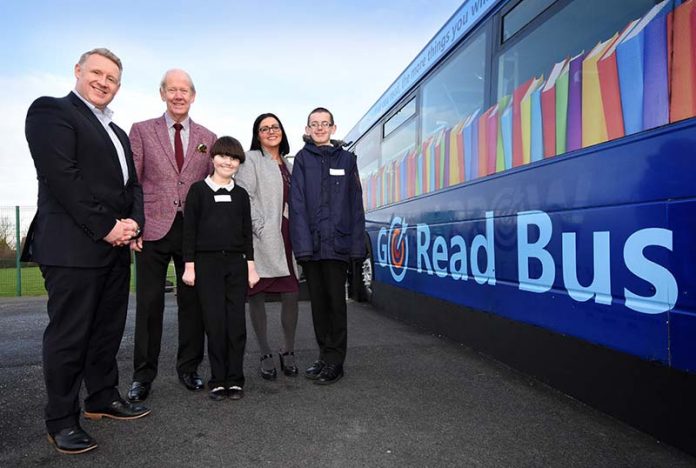 Colin Barnes, Brian Walker, Sara Swales and pupils Alexa and Harry with the new Go Read Bus. Colin Barnes, Brian Walker, Sara Swales and pupils Alexa and Harry with the new Go Read Bus.