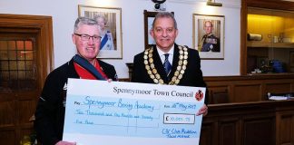 Former Mayor hands over funds to chosen charity Former Mayor of Spennymoor, Cllr Clive Maddison presents a cheque for £10,001.75 to Robert Ellis of Spennymoor Boxing Club.