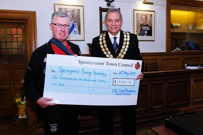 Former Mayor of Spennymoor, Cllr Clive Maddison presents a cheque for £10,001.75 to Robert Ellis of Spennymoor Boxing Club.