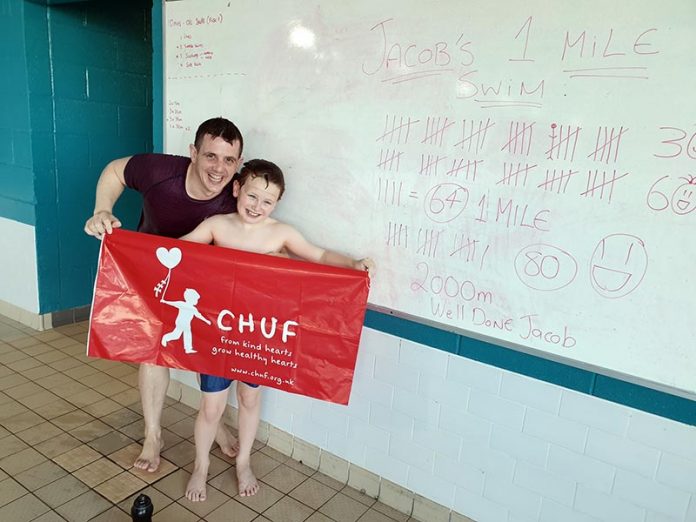 Jacob with coach, Will Coulson and the details of his 2000m swim. Jacob with coach, Will Coulson and the details of his 2000m swim.