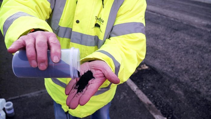 The rubber crumb which is being used in the surfacing mix.