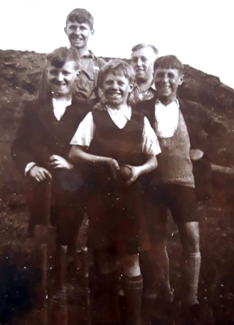 Can you help identify the mystery people in the photograph?