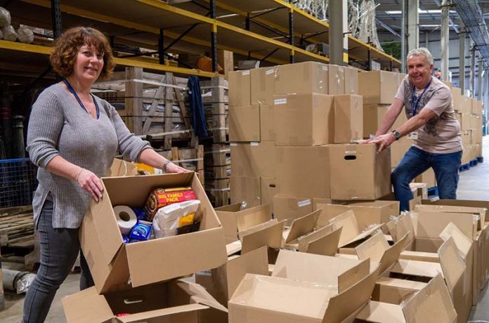 Durham County Council staff packing and preparing food boxes. Durham County Council staff packing and preparing food boxes.