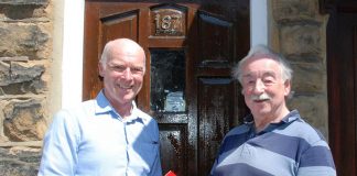 Books returned, 50 years later! Kevin Shaw and Michael Hall with the books returned books after years.