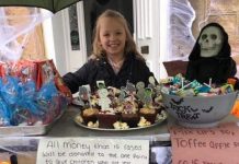 Kelsie helps others ring the bells for Christmas Kelsie King fundraising stall