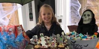 Kelsie helps others ring the bells for Christmas Kelsie King fundraising stall