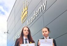 Young writers to be published poets Tamzin Iley and Cody Mather with their Young Writers certificates.