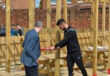 Community Garden opening rounds off Easter activities Club captain, Ben Trotter is accompanied by club chairman, David Dent as he cuts the ribbon to officially open the Shildon AFC Community Garden and, below, the children enjoyed their Easter activities. Words and pictures: shildonafc.com.