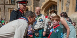 Louis receives top scout award from Bear Grylls Louis meets Chief Scout, Bear Grylls ahead of the official ceremony at Windsor Castle. Louis and his family have so far raised almost £10,000 for MDUK through the ‘Love for Louis’ fund, which can be donated to at www.musculardystrophyuk.org