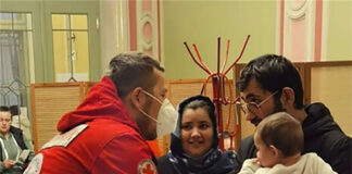 Durham Freemasons contribute to £500,000 for Ukrainian refugees Red Cross medic in Poland helping a family newly arrived from Ukraine
