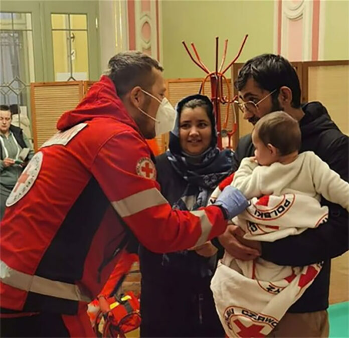 Red Cross medic in Poland helping a family newly arrived from Ukraine Red Cross medic in Poland helping a family newly arrived from Ukraine