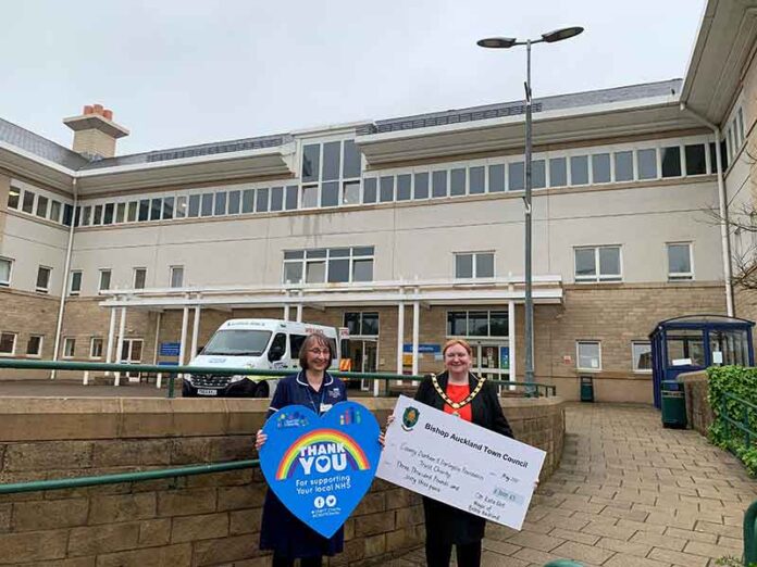 Alison-Bottoms-&-Mayor-Eliot-with-Cheque Ward Sister, Allison Bottoms receives a cheque for £3,000.63 from outgoing mayor, Cllr Katie Eliot.