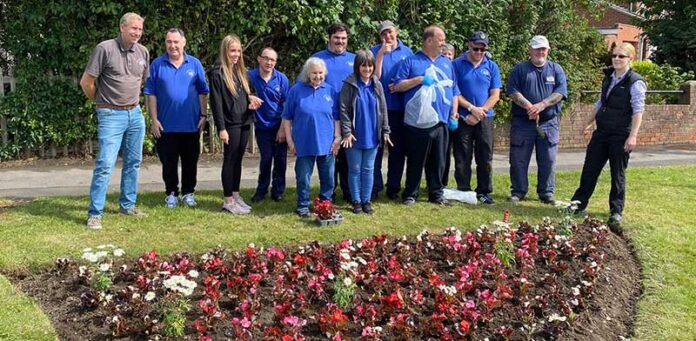 Dean-Road-Flower-Bed Endeavour staff and service users at the flower beds on Dean Road.