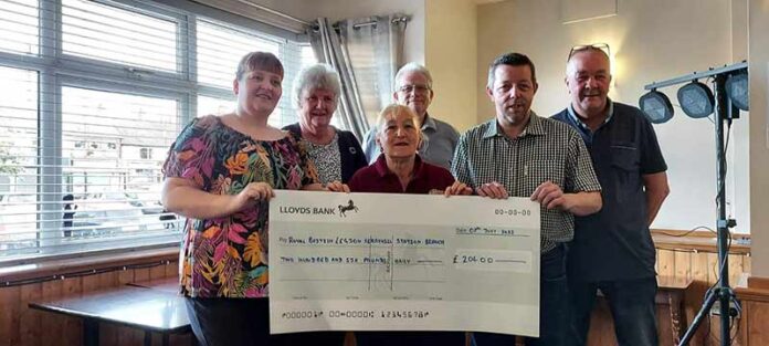 Members of Ferryhill Station RBL accept a cheque from members of Ferryhill Sports and Social Club.