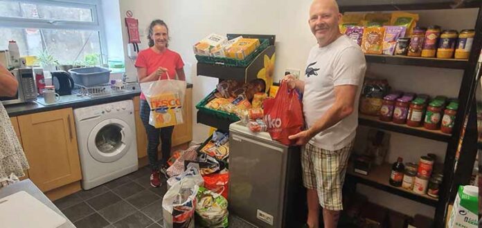 supporters-club-shildon-alive Committee members, Susan Clarkson and Tom Clegg deliver a large donation of food from Shildon AFC Supporters Club.