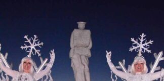 Sam switches on town lights