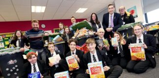 Students help restock local foodbanks Students from Whitworth School display some of the foodbank items they have collected.