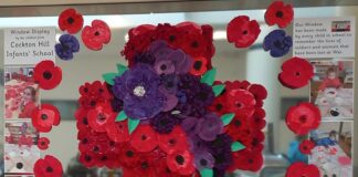 Schools decorate forces shop