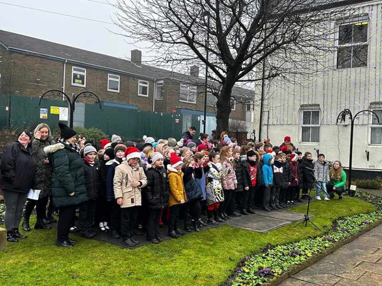 Community enjoy carol singers Community enjoy carol singers