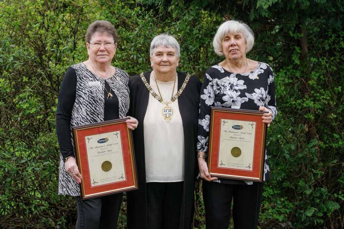 Trio of volunteers receive Chairman's Medal: Betty Minto, Christine Clarke, Cllr Joan Nicholson. Trio of volunteers receive Chairman's Medal: Betty Minto, Christine Clarke, Cllr Joan Nicholson.