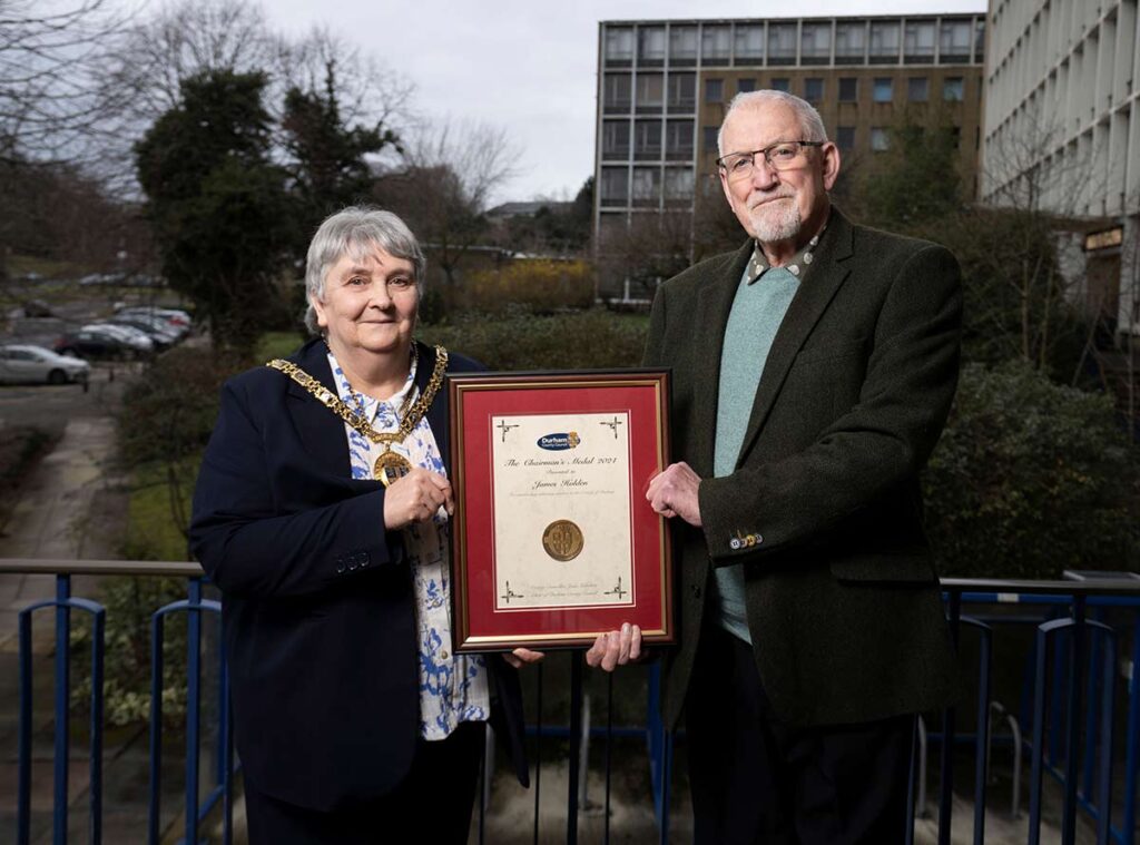 James Holden receives the Chairman's Medal from Cllr Joan Nicholson.