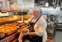 Tracey hangs up her apron