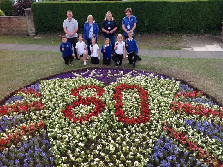 Pupils help plant VE Day flower bed Pupils help plant VE Day flower bed