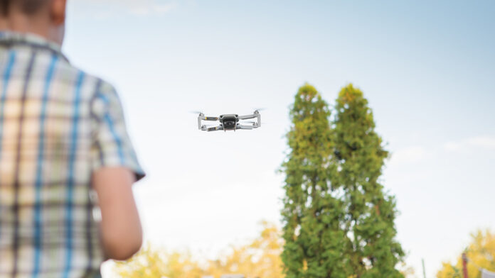 person-flying-drone
