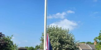 Flag raising ceremony in Newfield Park