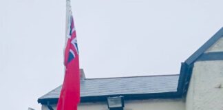 Chilton 1st Scouts and Beavers proudly raise the Red Ensign