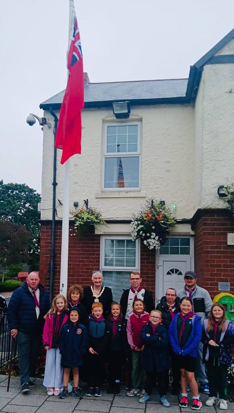Chilton 1st Scouts and Beavers proudly raise the Red Ensign